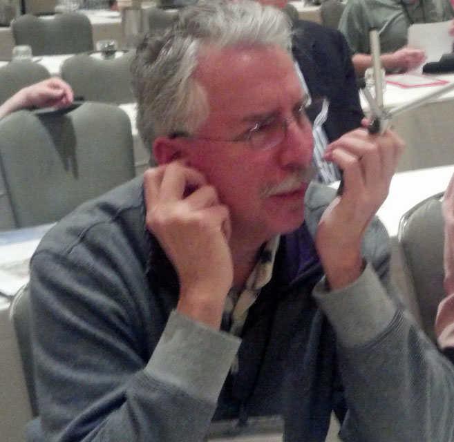 Miles talkingon Iphone with Tripod cropped